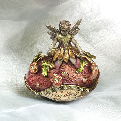 Enamel egg box with winged fairy wearing a daisy petal skirt.
