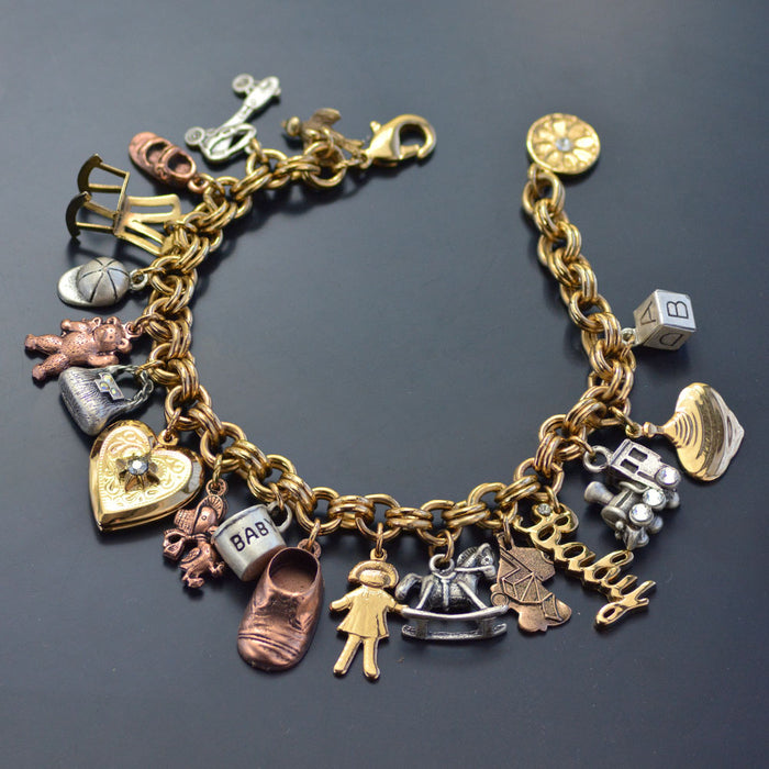Sterling Silver Vintage Charm Bracelet with 9 Assorted Charms